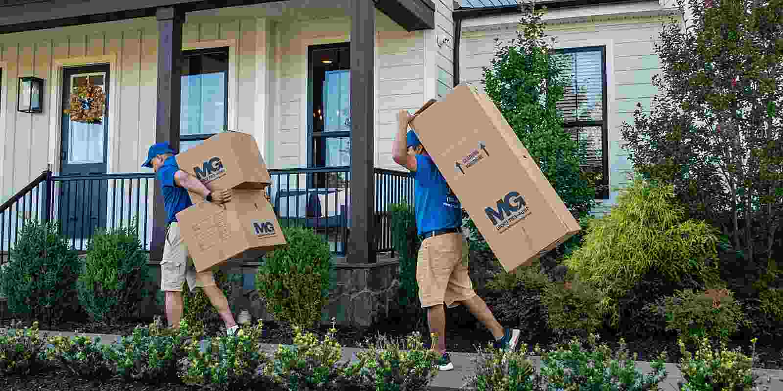local movers carrying boxes into a home