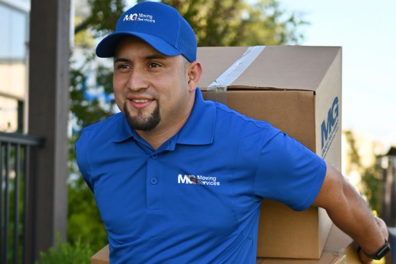 mover-carrying-boxes-on-sidewalk