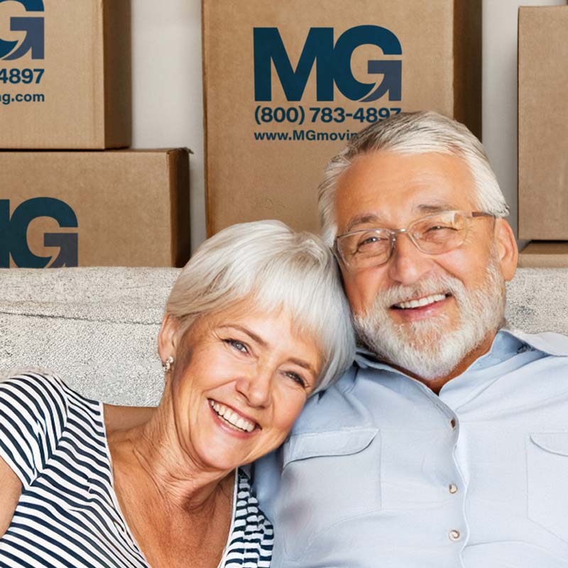 elderly couple working with a senior moving company