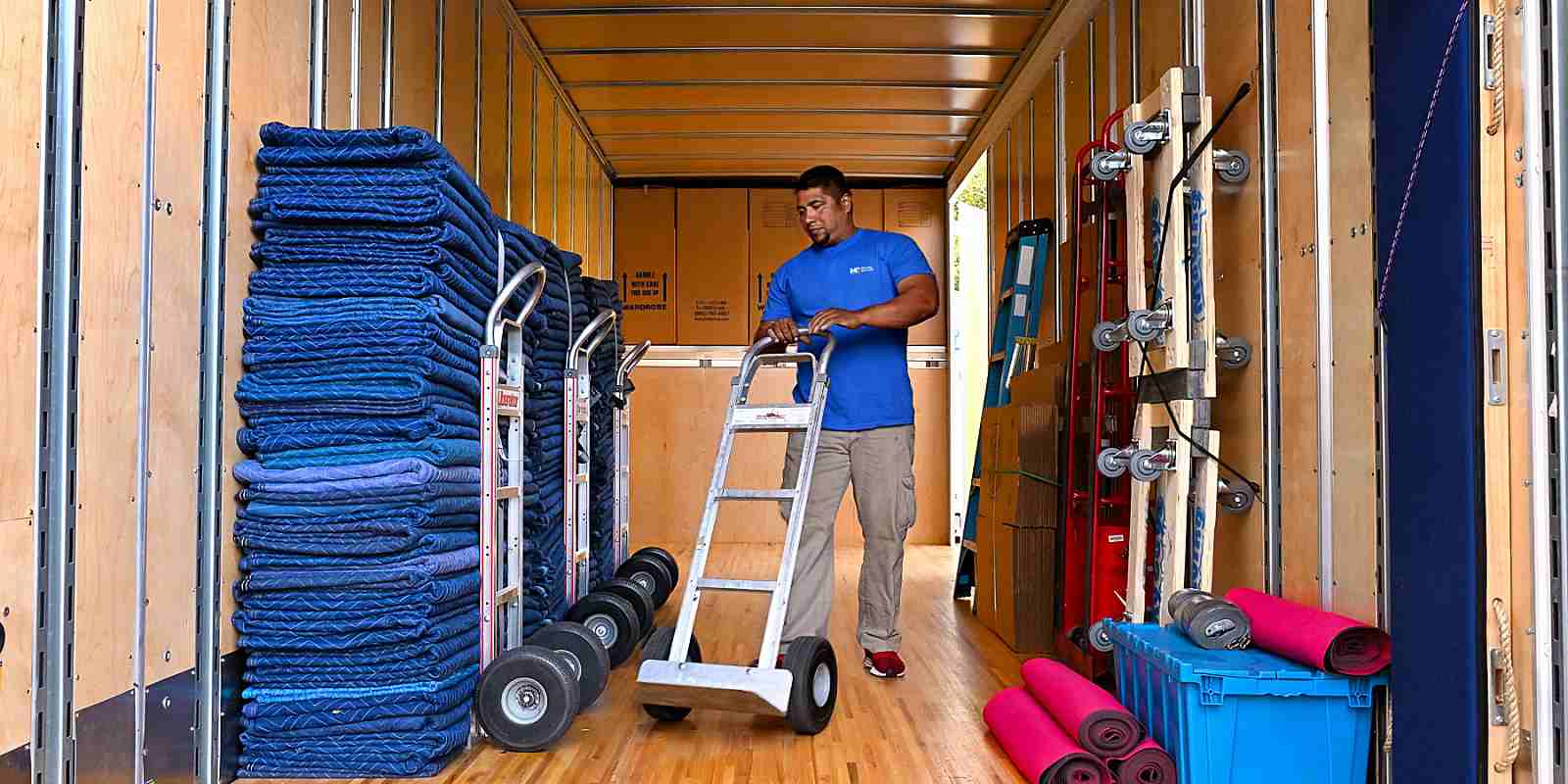 moving professional inside truck grabbing equipment