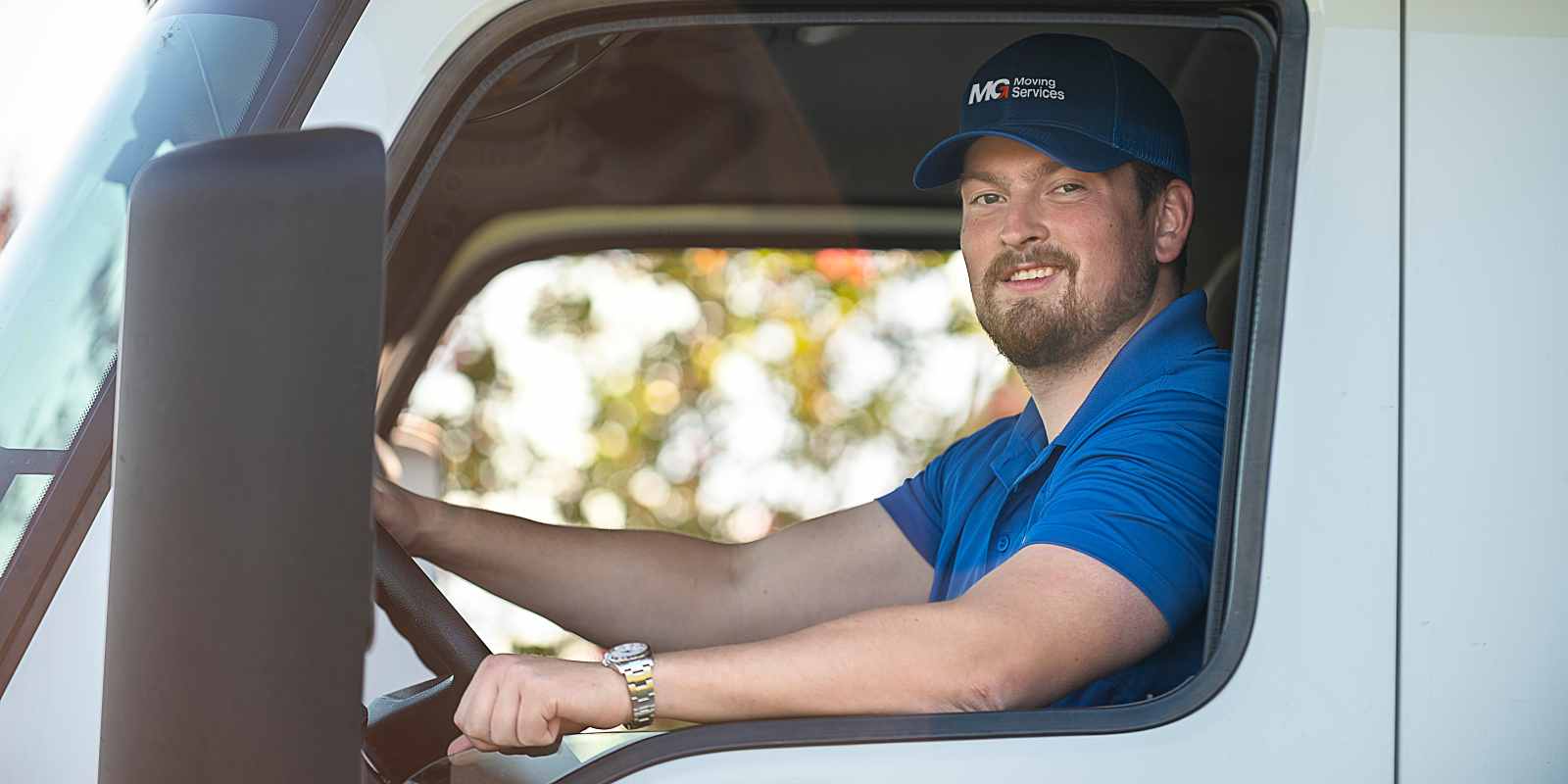 professional mover sitting in a moving truck