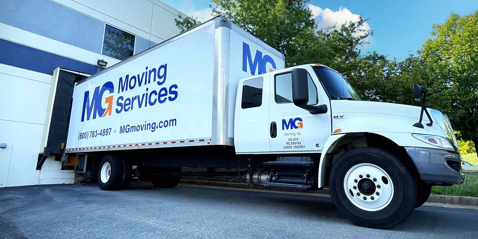 commercial moving truck in position for move