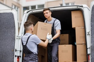 moving guys taking out boxes out of van