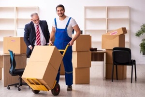 old businessman and young contractor in relocation concept