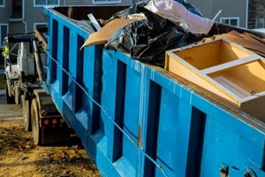 dumpster, recycle waste and garbage bins near new construction site of appartment houses building