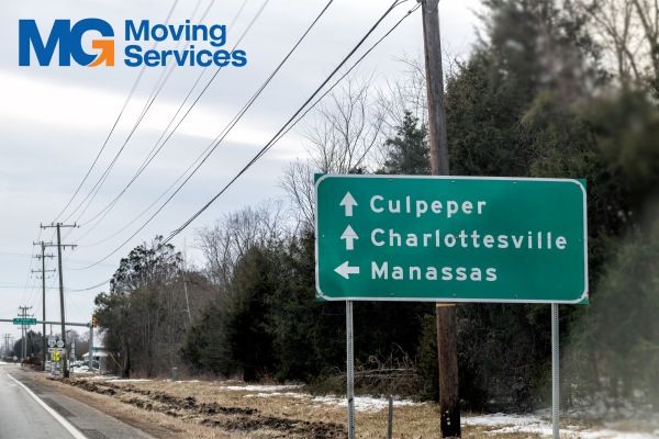 Manassas VA Movers Driving Past Manassas Virginia Sign