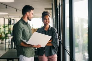 software engineer using laptop computer with global network connection
